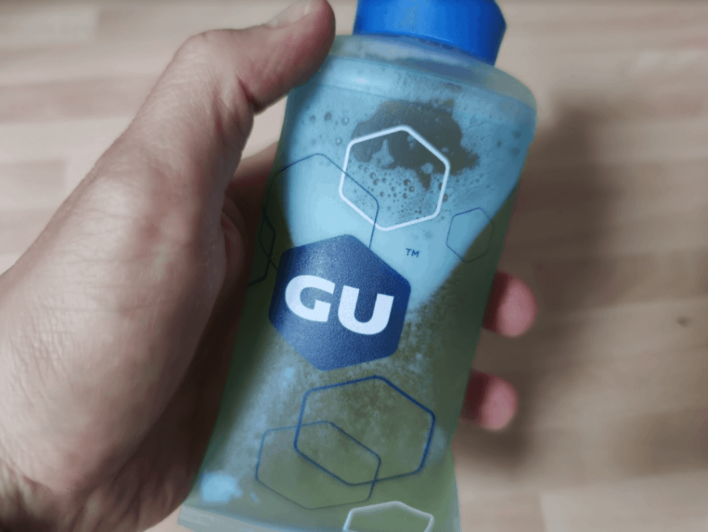 reusable GU flask filled with honey