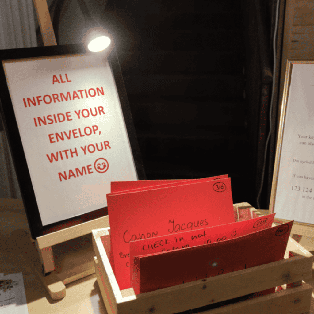red envelopes and a sign at the check in at the hotel