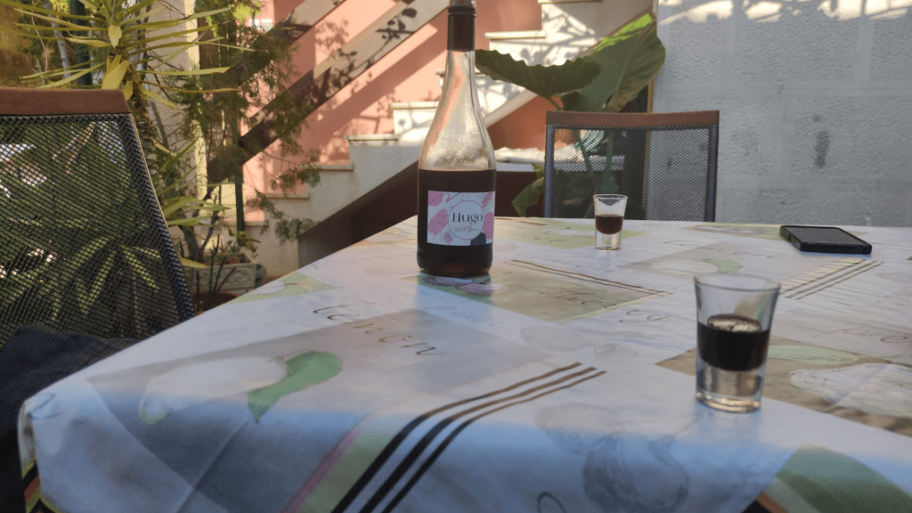 bottle of wine and 2 glasses on a table